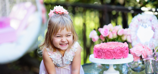Toddler laughing at her birthday party
